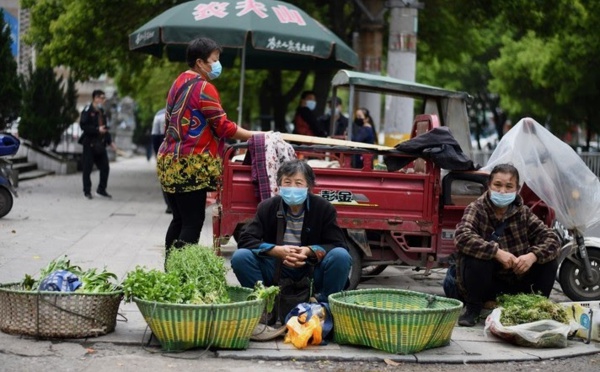 Même sans bouclage, la peur demeure dans le berceau du virus en Chine